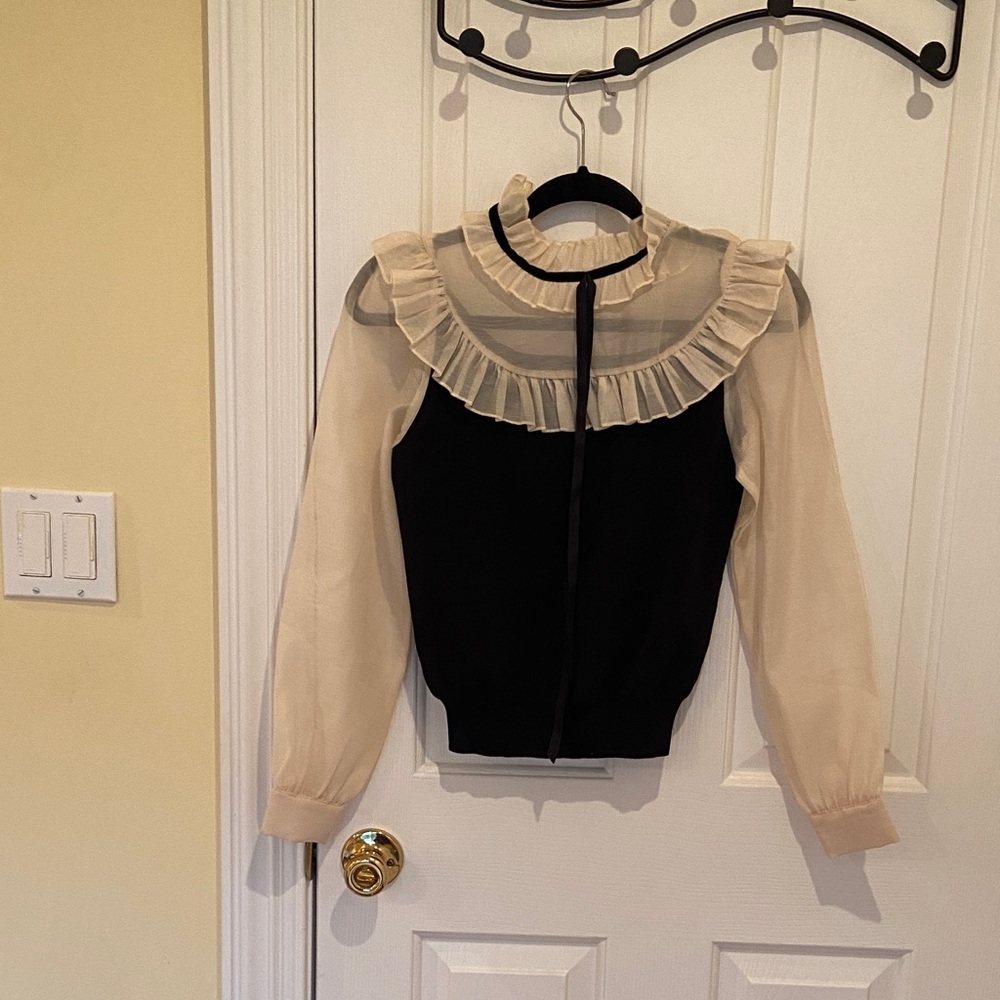 Chic Black and Cream Ruffle Blouse